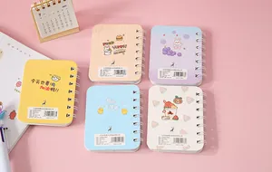 Set of five cute cartoon mini spiral notebooks in various pastel colors and patterns.