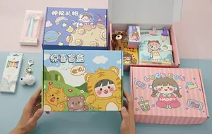 Adorable cartoon stationery mystery box gift set featuring notebook, pens, and bear keychain.