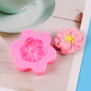 3D flower-shaped pink silicone mold with realistic finished clay floral decoration detail
