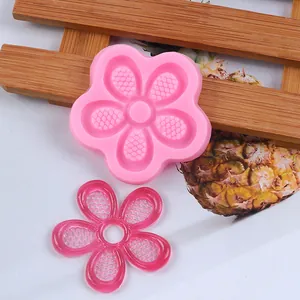 Detail view of pink sunflower silicone mold with a translucent resin flower piece.