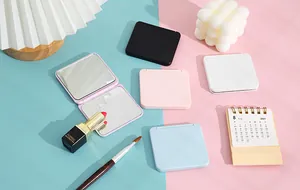 Lifestyle display of portable candy-colored square foldable makeup mirrors