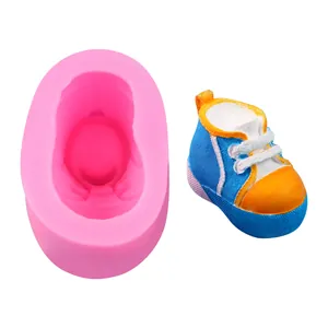 Detailed view of baby shoe silicone mold and finished colorful resin sample