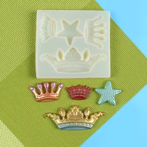 Detailed macro shot of silicone craft mold alongside gold and bronze crown resin castings