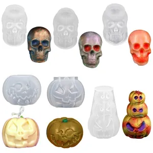 Detailed Halloween skull and pumpkin silicone molds showing finished candle creations