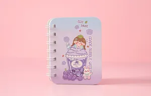 Mini spiral notebook featuring cute purple cartoon grape soda illustration on cover.