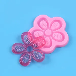 Detailed view of pink five-petaled flower silicone mold and purple resin casting piece
