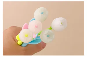 Macro view of photochromic tulip gel pens featuring soft silicone flower-shaped tops