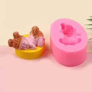 Macro view of a pink silicone mold showing a detailed sleeping baby for resin casting