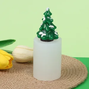 Detailed view of white silicone candle mold with a finished green Christmas tree ornament