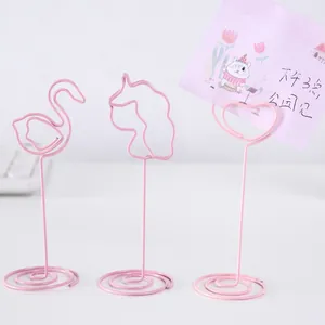 Set of cute pink metal wire memo holders in flamingo, unicorn, and heart shapes.