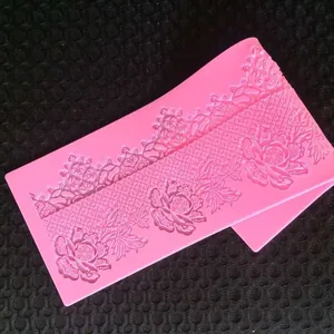 Close-up detail of a pink lace flower silicone mold for fondant cake decoration DIY baking