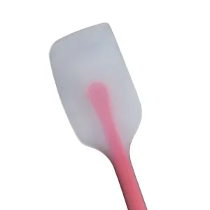 Macro view of translucent silicone spatula head showing the durable pink nylon core detail.