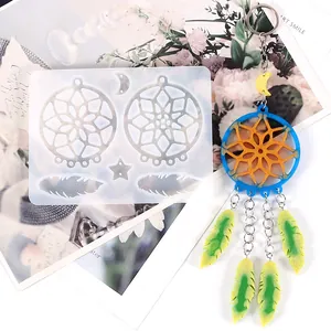 Detailed close-up view of a DIY dreamcatcher silicone mold with a finished resin craft