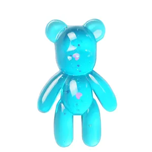 Close-up of a translucent blue gummy bear made from a silicone DIY resin mold.