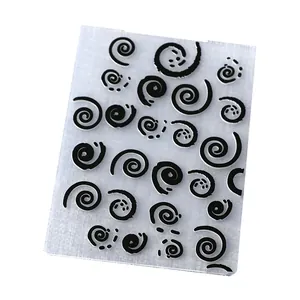 Close-up of clear plastic embossing folder with spiral vortex patterns for DIY paper crafts