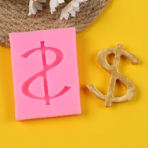 Detailed view of pink silicone mold featuring a dollar sign with golden finished piece.