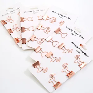 Hochwertige roségoldene Metall-Bindeklammern in kreativen Flamingo- und Herzformen