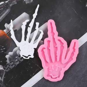 Detailed macro view of pink skeleton hand silicone mold for Halloween DIY cake decor