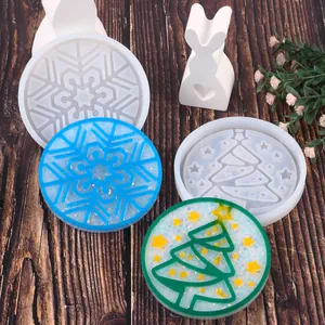 Detailed view of Christmas silicone molds with snowflake and tree resin coaster samples