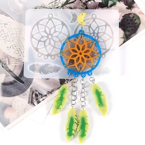 Detailed view of translucent silicone dreamcatcher resin mold with finished sample