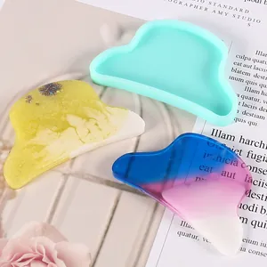 Detail view of cloud shaped silicone mold and colorful glossy resin hair clip accessories