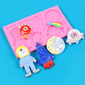 Detail view of space-themed silicone mold with colorful astronaut and rocket figures