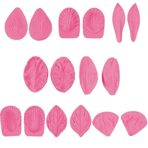 Detailed pink silicone molds set for floral petal and leaf fondant cake decorations.