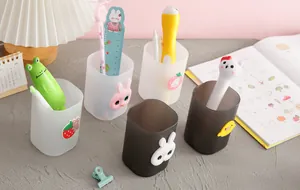 Variety of cute cartoon pen holders with 3D animal charms for desktop stationery organization