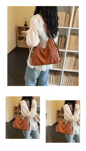 Elegant large brown leather hobo shoulder bag for women displayed in a lifestyle setting