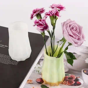 Flexible silicone mold for DIY resin vase shown next to a finished green floral decorative vase