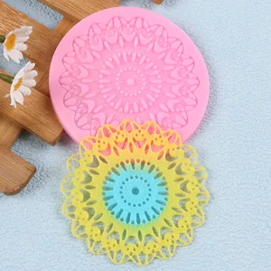 Close-up view showing the intricate lace mandala design on a pink silicone mold
