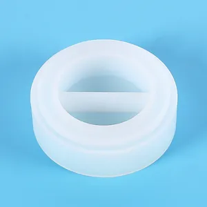 Detailed top view of a translucent circular silicone mold with a central divider for resin
