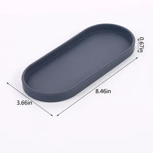 Detailed dimension view of a 21.5cm oval silicone storage tray in dark gray color