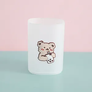 Frosted semi-transparent pen holder featuring a cute cartoon bear holding a bubble tea