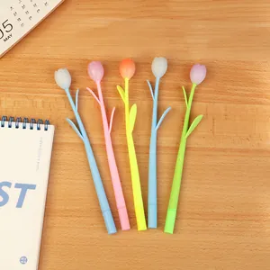 Set of five creative tulip-shaped color-changing gel pens on a natural wooden desk