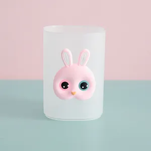 Front view of frosted transparent pen holder with 3D pink cartoon bunny face detail.