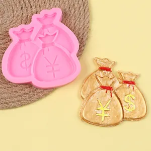 Detail of money bag silicone mold with dollar and yen symbols for DIY cake decor
