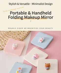 Close-up of portable folding makeup mirrors with cute 3D cartoon animal designs