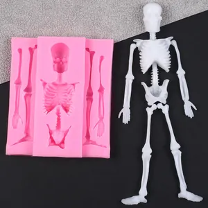 Detailed view of a pink Halloween skeleton silicone mold with white finished skeleton.