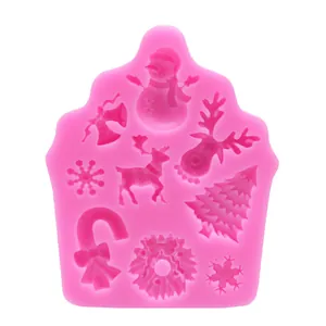Close-up macro view of a pink Christmas silicone mold featuring various festive patterns