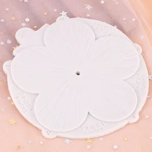Detail view of white flower petal silicone mold for fondant cake decoration