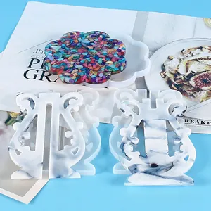 DIY resin silicone molds for lyre shaped stands and flower shaped coaster base.