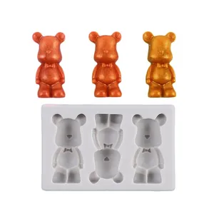 Detail view of a 3-cavity silicone mold with finished bear-shaped figurines