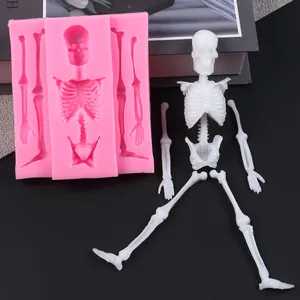 Close-up of Halloween skeleton silicone mold showing white finished skeleton components