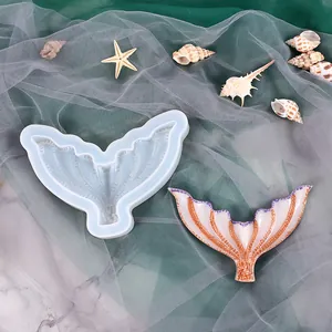 Macro detail of a mermaid tail silicone mold with a finished sparkling resin craft piece