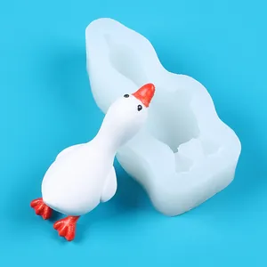 Weiße Silikon-Entenform und fertige Gips-Entenfigur für kreative DIY-Kuchendekoration
