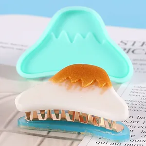 Detail of DIY Fuji mountain silicone mold with finished resin hair clip accessory.