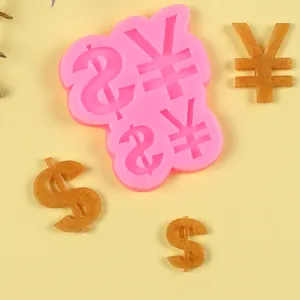 Detail view of pink silicone mold with dollar and yen symbols for DIY crafts