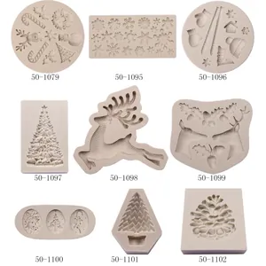 Detail view of various Christmas-themed silicone molds for cake decorating and DIY baking.