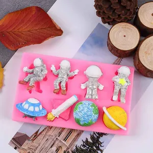 Detail showing space-themed silicone mold with astronaut and rocket shapes